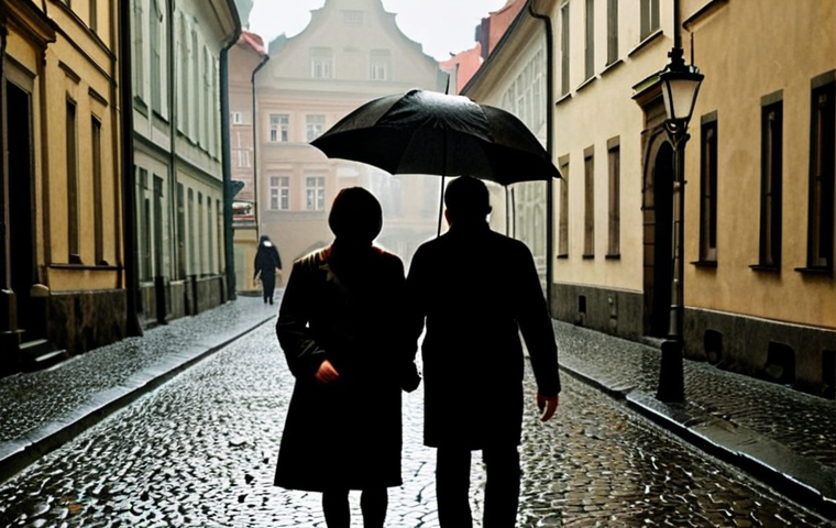 ** A stark, slightly blurred photograph of a cobblestone street in Prague, rain-slicked and reflecting dim streetlights. In the foreground, a couple walks hand-in-hand, their faces obscured. The overall tone should be melancholic and suggestive of historical weight and political oppression subtly impacting personal relationships. The style should evoke a Central European film from the 1980s.
**